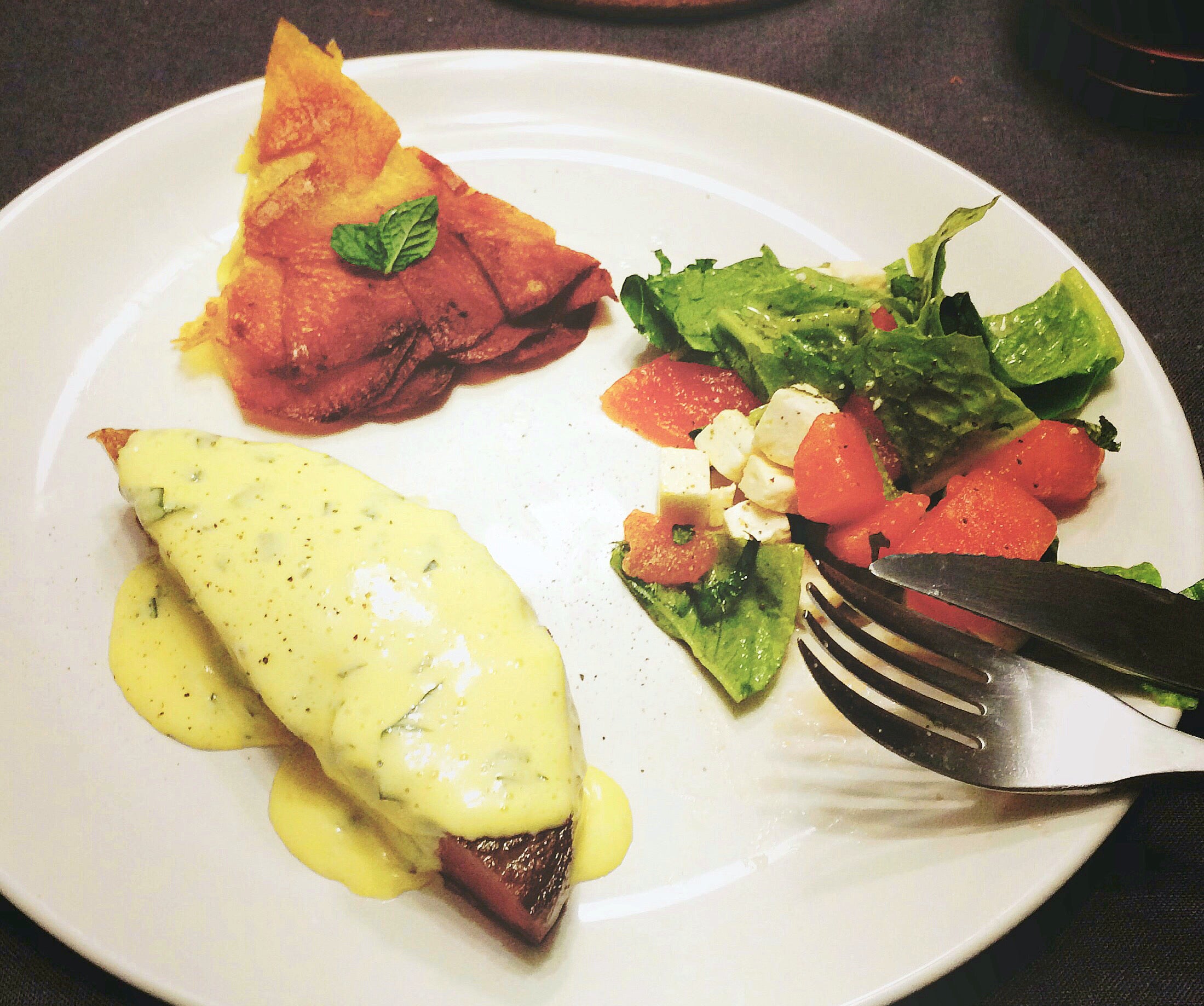 sauce béarnaise, ribeye cap, pommes anna, and watermelon feta salad