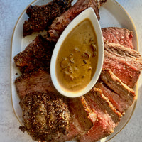 Bone in rib roast with mushroom au poivre sauce